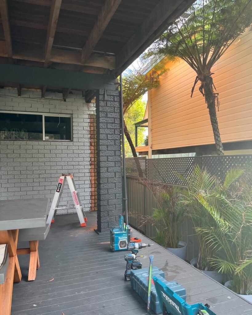 Deck infill wall built against a brick home